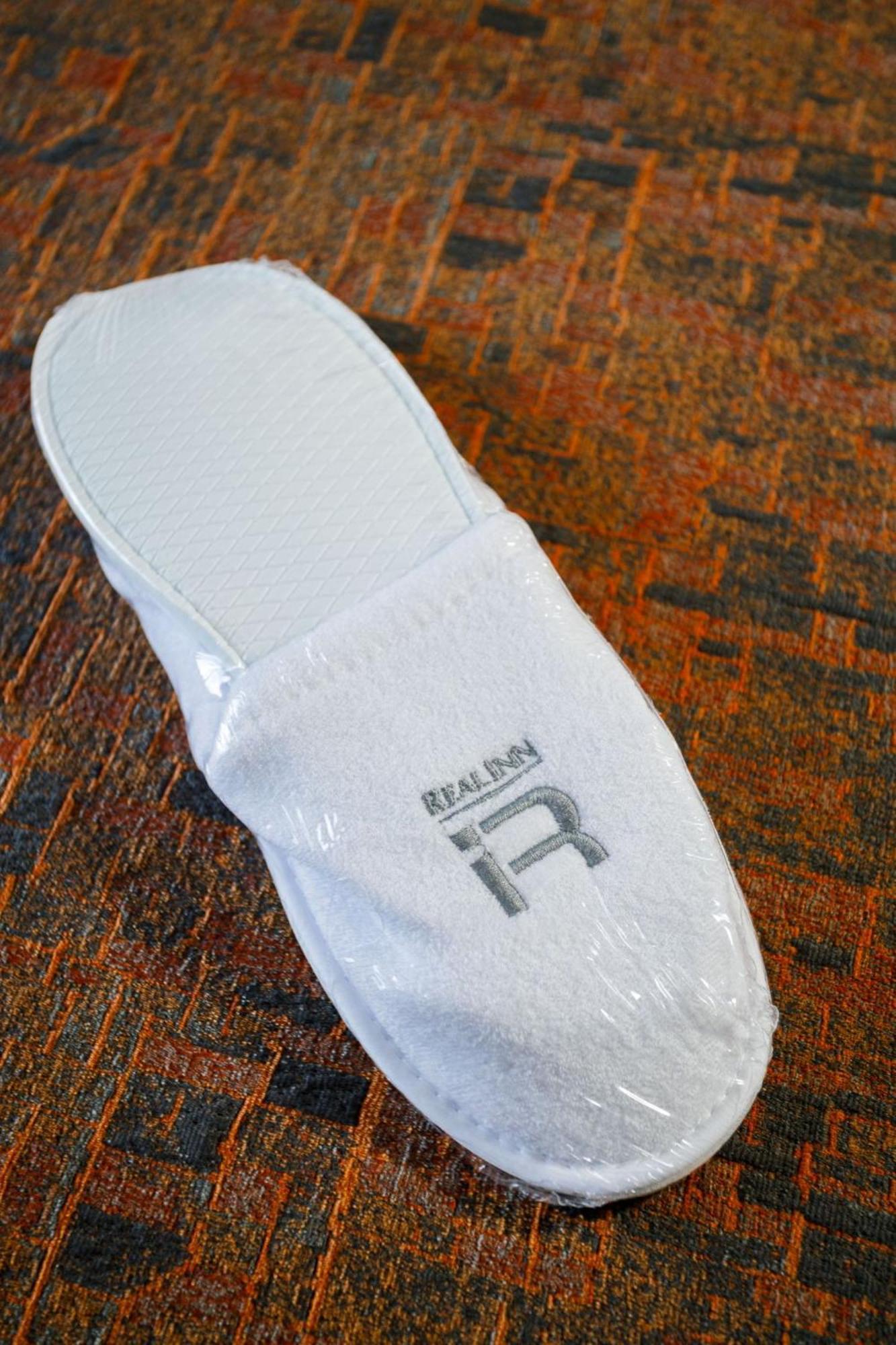 Real Inn Tijuana By Camino Real Hoteles Экстерьер фото A pair of hotel slippers